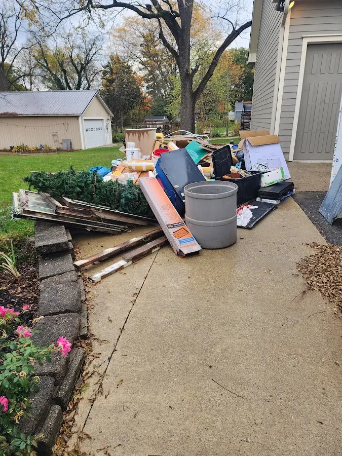 Dumpster being loaded with debris for Estate Cleanout Dumpster Rental in Gages Lake
